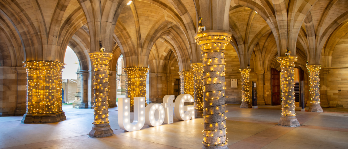 cloisters with light and UofG sign