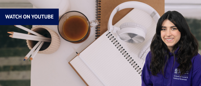 Open books with headphones and a cup of coffee with a smiling woman