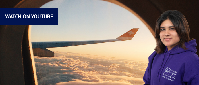 View over the clouds from a plane window with headshot of smiling woman
