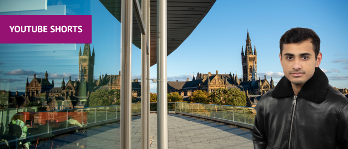 View of the Gilbert Scott Building from the JMS Balcony with headshot of man