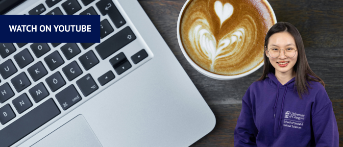 Laptop keyboard and coffee next to headshot of smiling woman