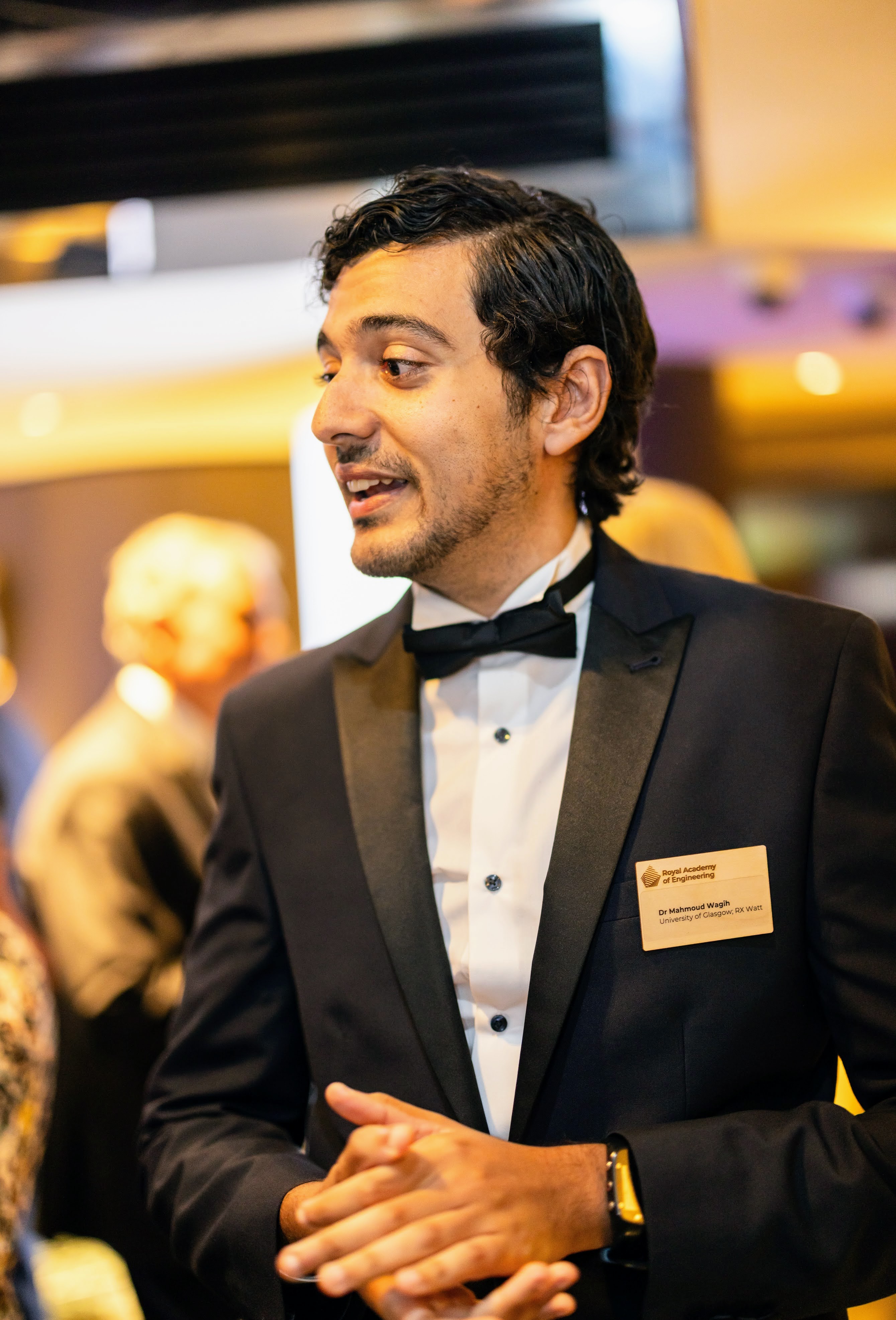 Portrait picture of Mahmoud Wagih, speaking at a public event