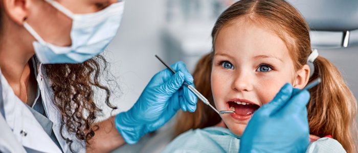 A young girl at the dentist