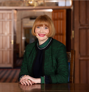 Professor Rachel Sandison seated at a table