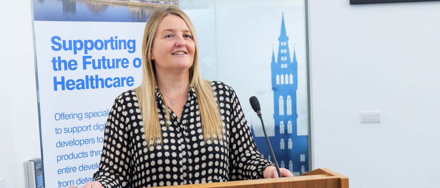 Dr Ruth McLaughlin speaking at a healthcare conference