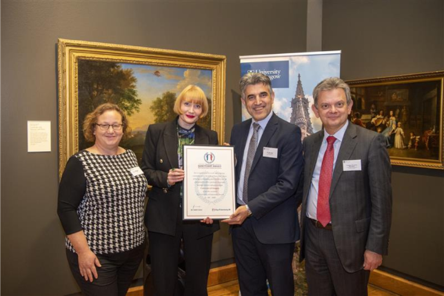 members of university of glasgow accepting certificate for University of Sanctuary