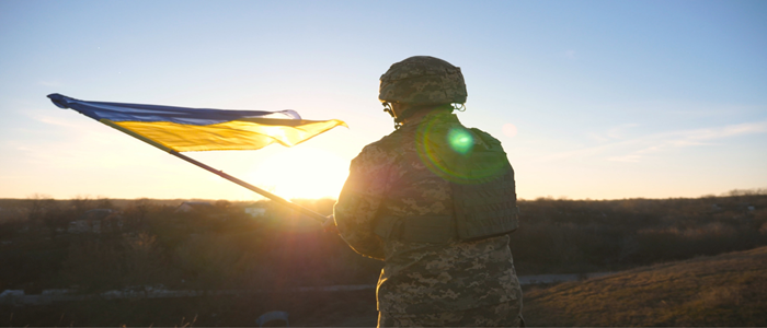 Ukraine solider holding flag