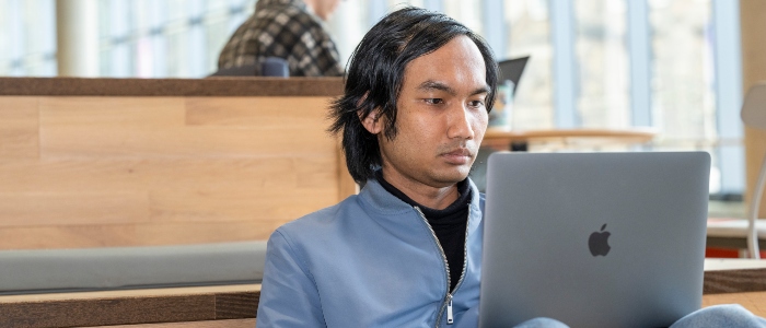 A student studying in the James McCune Smith Learning Hub