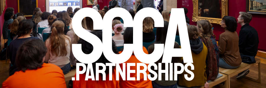 White bold text 'SCCA.PARTNERSHIPS' with students in the background
