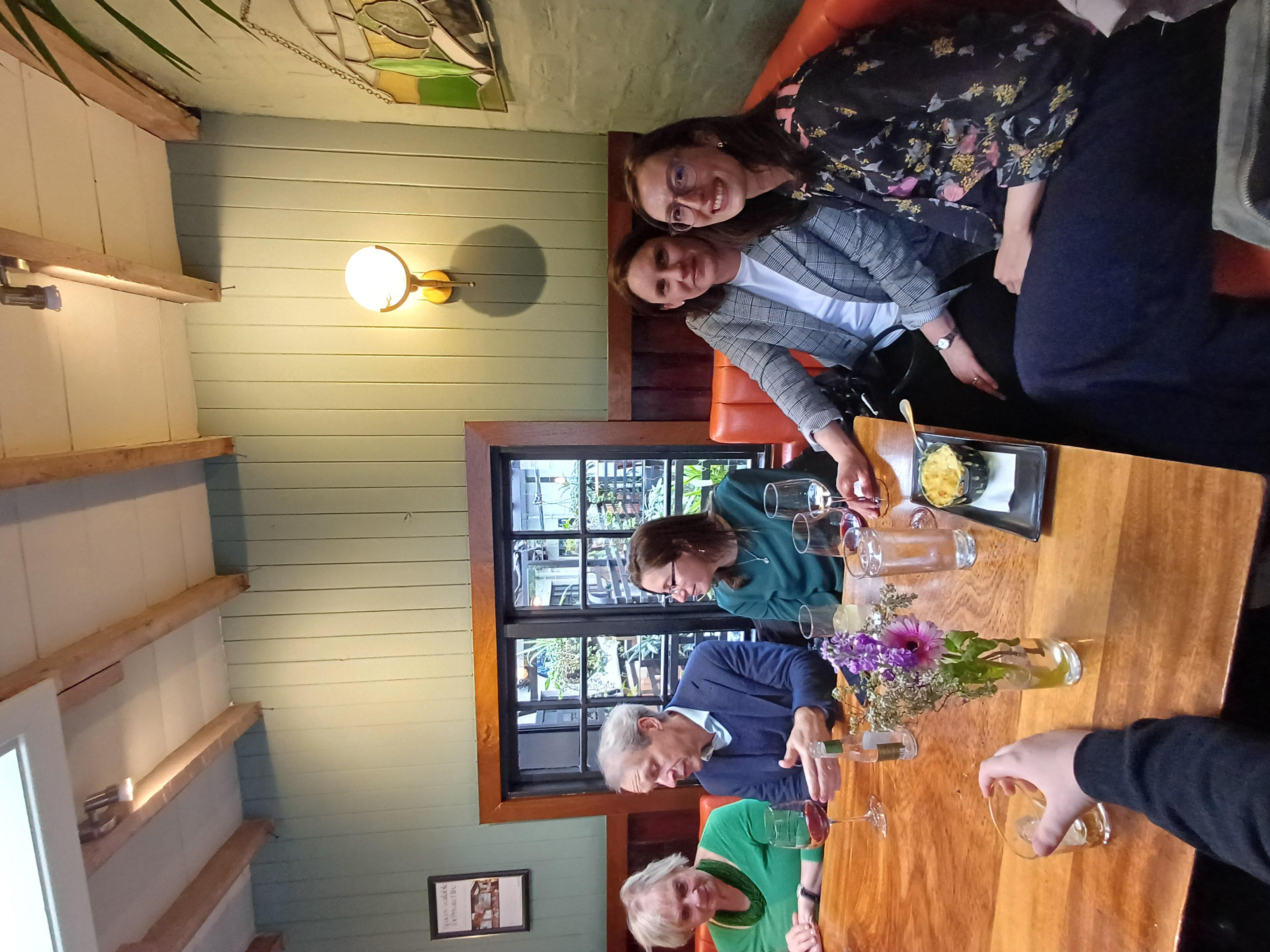 Staff and students from the Comp Lit department celebrate the programme's 20th anniversary at a restaurant