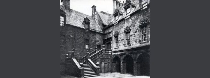 Black and white photo of external stairs of the old college building