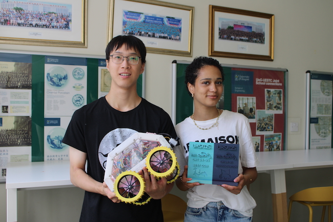 Zlatan Čeljo and Phoenix Nelson holding the rover, along with two of our three prizes. The prize on the left is for Best CDR, while the one on the right is for Best Innovation
