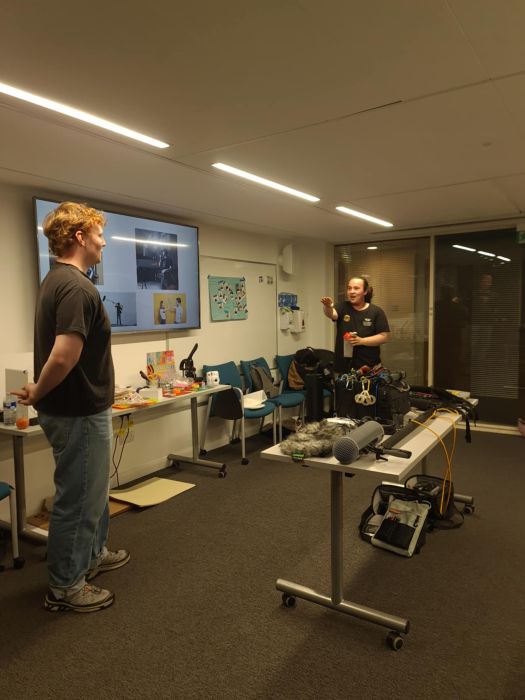 Two people speaking while presenting