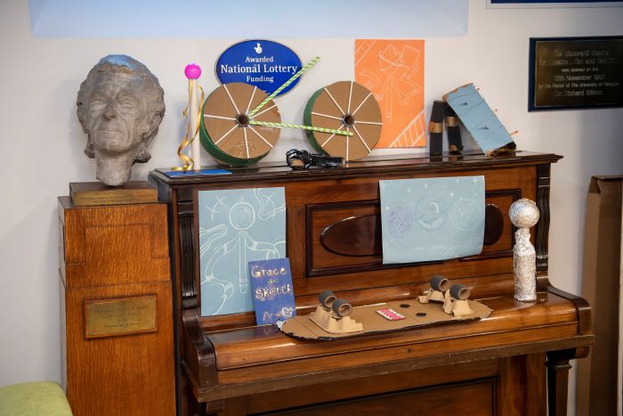 cardboard props sitting on a piano