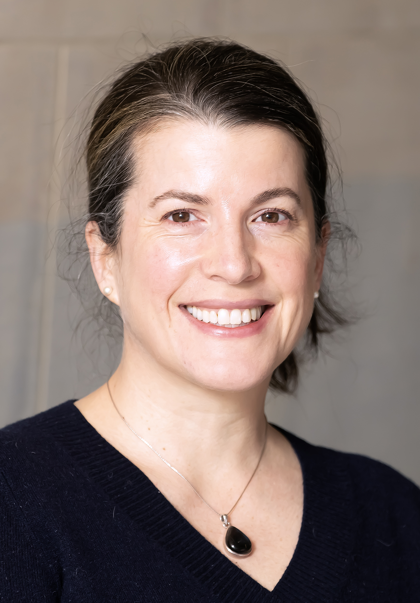 A photo of a smiling woman