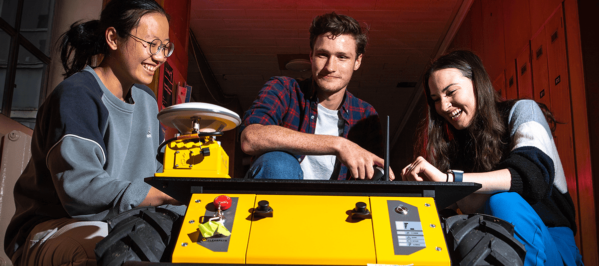 a group of young people with computers