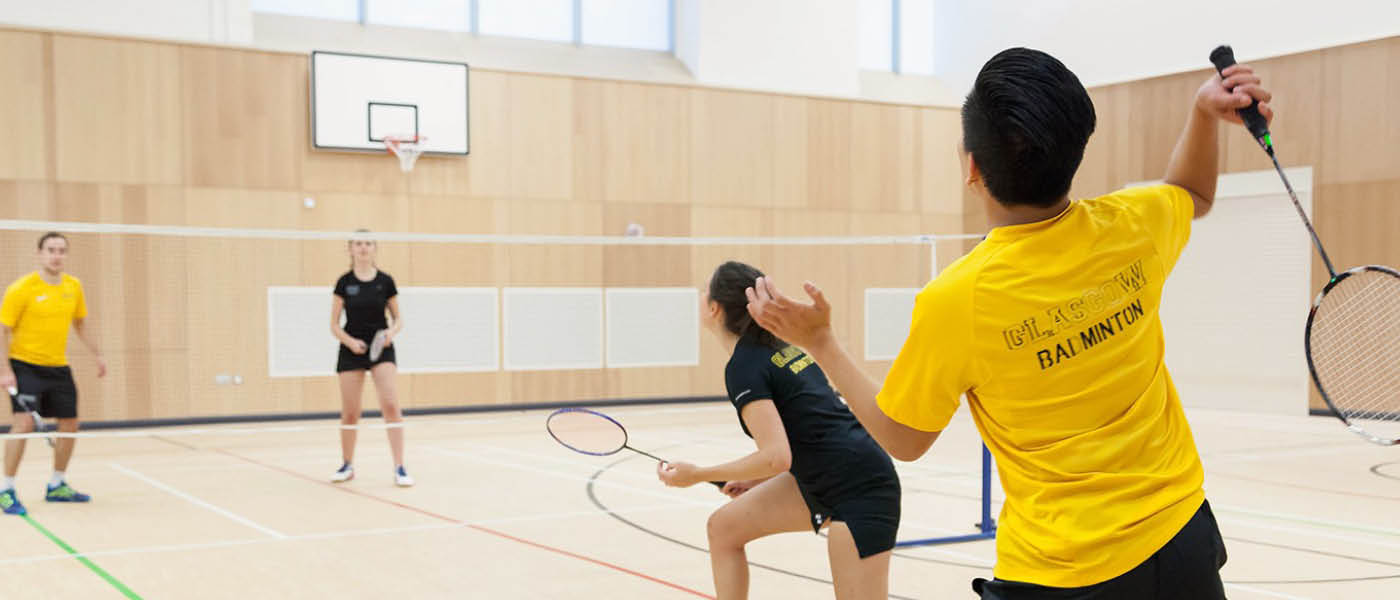 Students playing a game of badminton