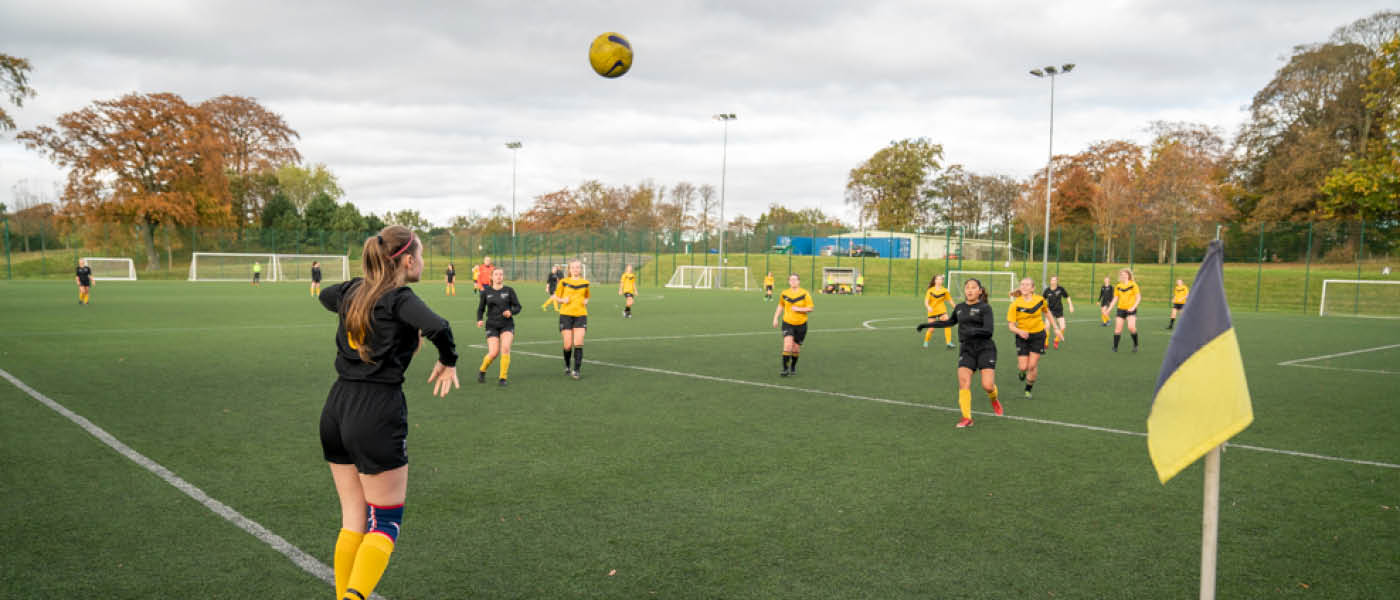 Students playing a game of football