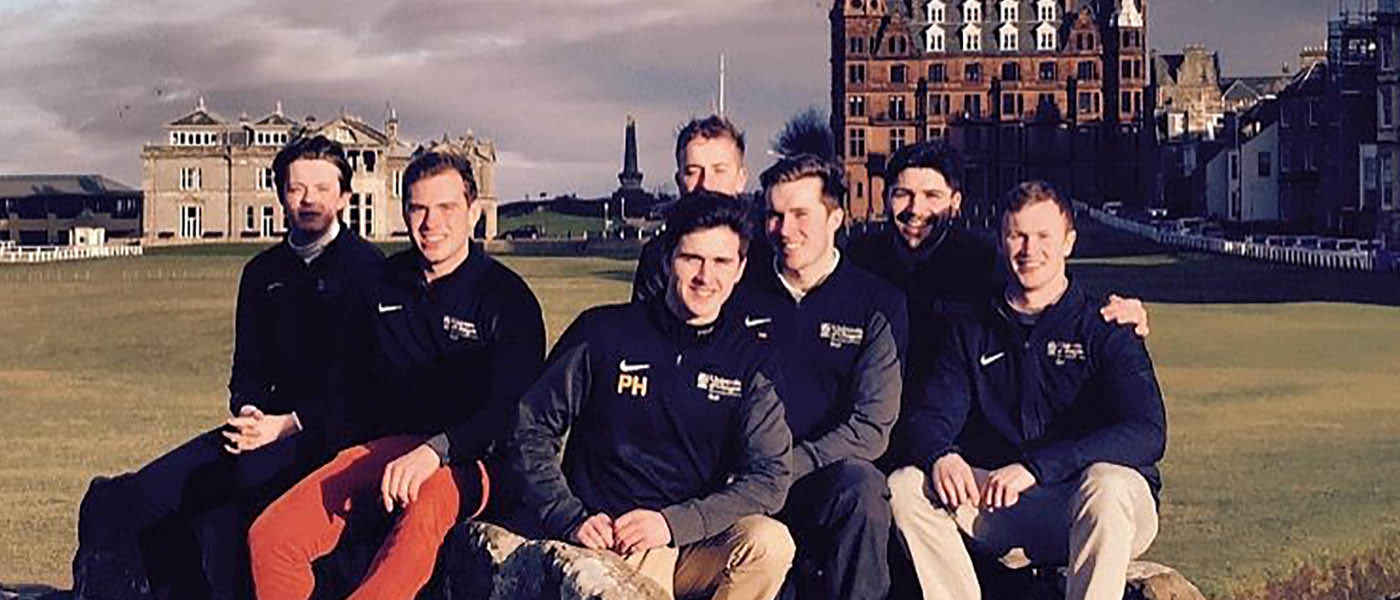Golf club members posing for a photograph at St Andrews