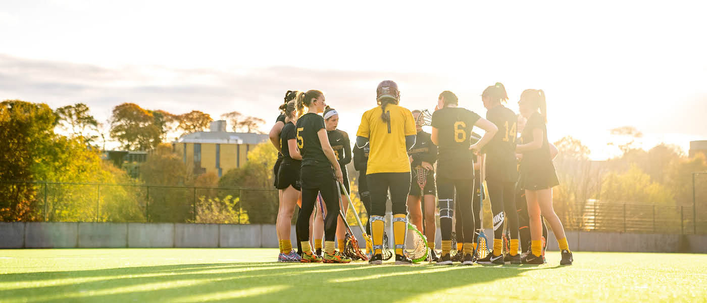Lacrosse team in a huddle