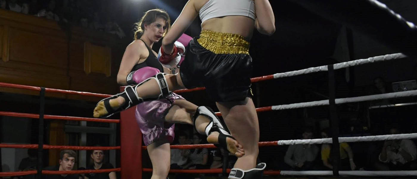 Two students competing in a Muay Thai competition