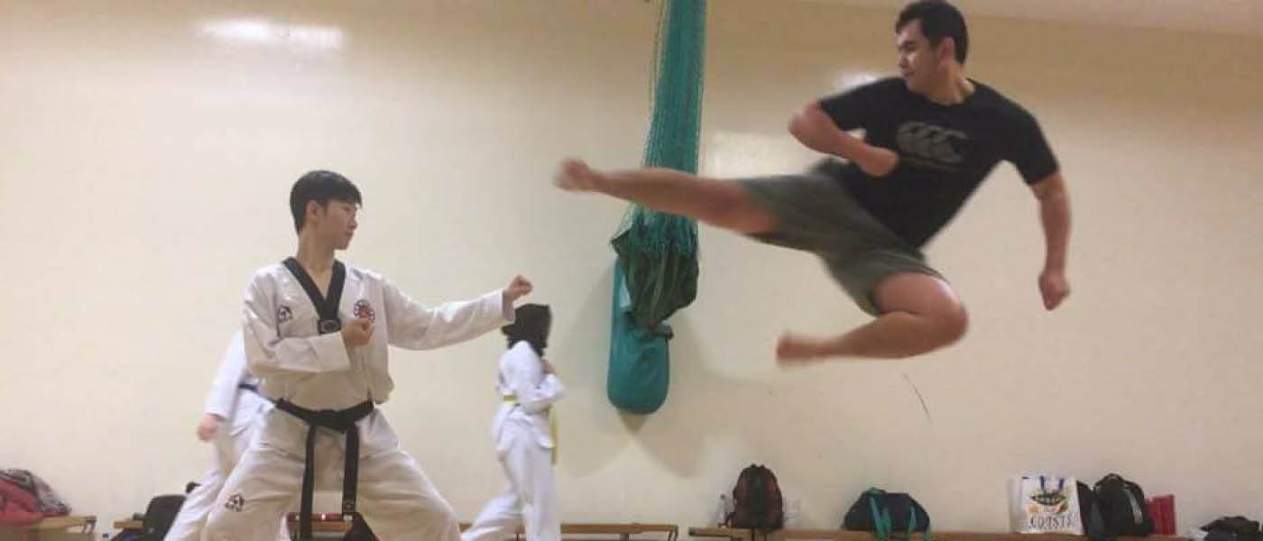 Two students practising taekwondo
