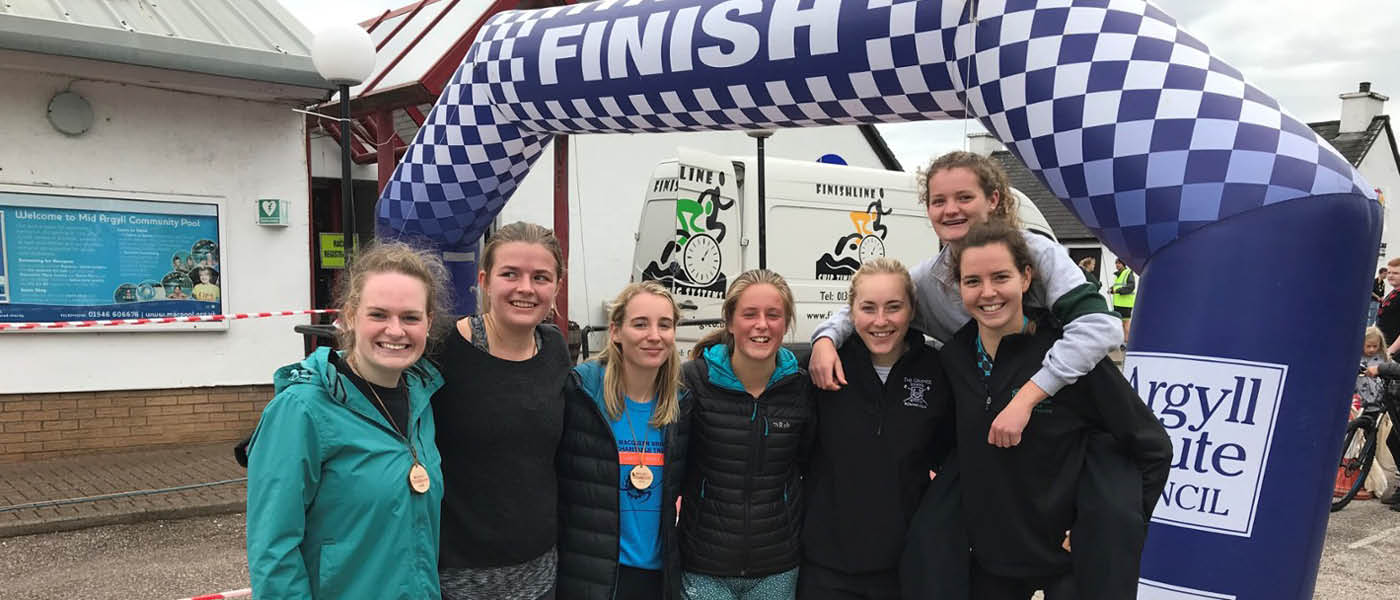 Students posing for photograph after a triathlon event