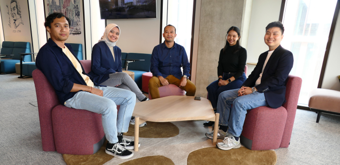 Five international students sitting together