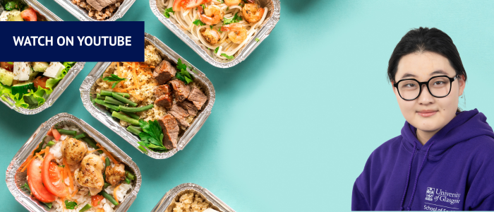 In the left-hand corner there is a blue box with 'Watch on YouTube' written. The background image is a turquoise background with meal prepped meals in silver containers on the page. Headshot of woman in a purple hoodie in the right-hand corner.