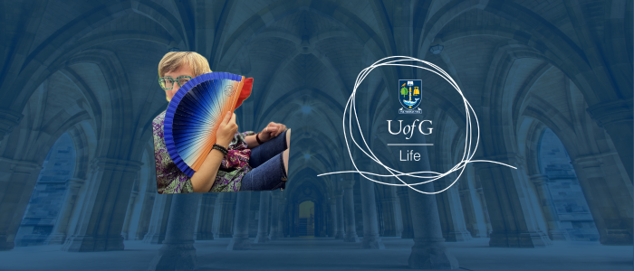 image of Sara Somerville holding a fan on a blue background