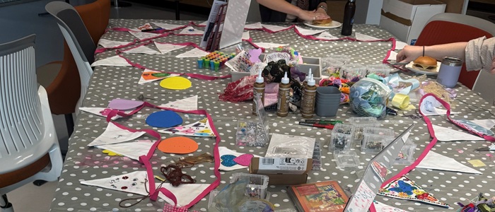 Bunting and craft materials on a table with polkadot tablecloth