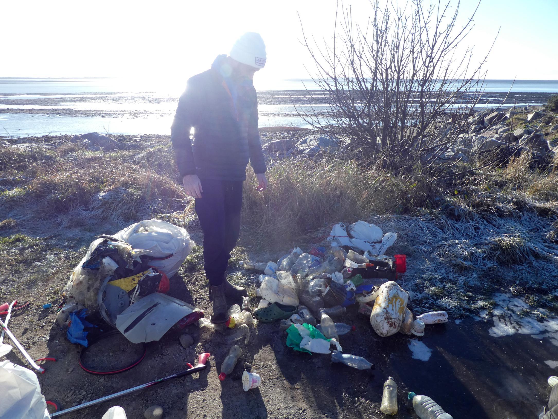 Student Inspects pile of waste