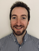 A head and shoulders portrait shot of John Kelly