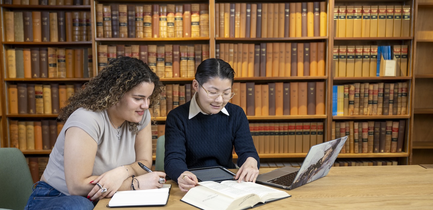 2 students studying in the law workshop