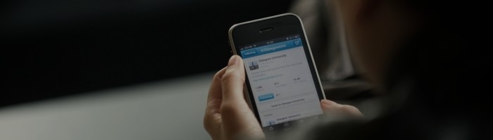 A student holding a mobile phone