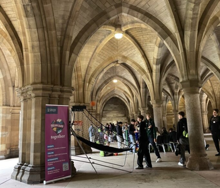 A photo of students attending and playing games at a team uofg together event in the cloisters