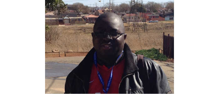 Manase Chiweshe, smiling at camera