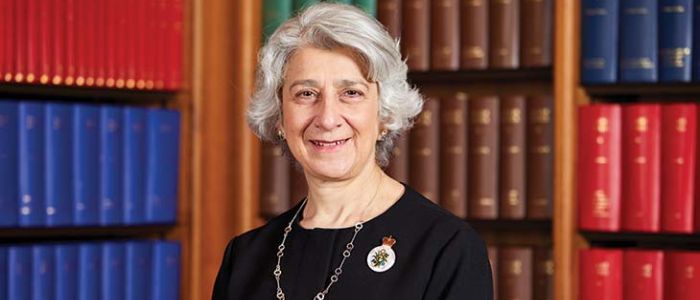 Portrait of a female judge, with books in the background