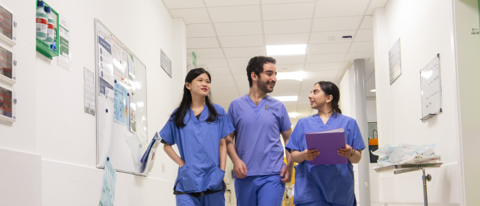 Vet Students Walking Down a Hallway at the Small Animal Hospital