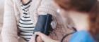 A woman is having her blood pressure taken