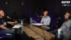 An image of podcast host Derek McEwan and experts Gwo-tzer Ho and Konstantinos Gerasimidis sat in the studio with mics and a large wooden desk. Derek is sat to the left, with Gwo-tzer and Kostas on the right, facing Derek.
