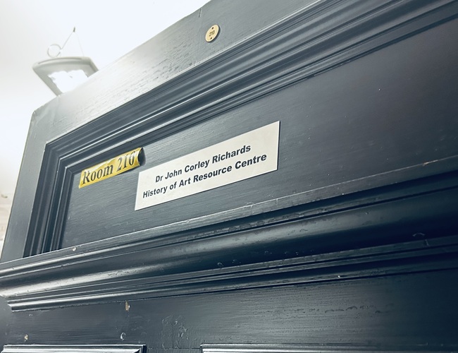 A plaque on a door which says Dr John Corley Richards History of Art Resource Centre
