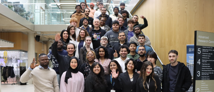 Participants at StartUp Factory Scotland Weekend pose fpr a photograph on the atrium stairs within the Advanced Research Centre at the University of Glasgow, November 2025.