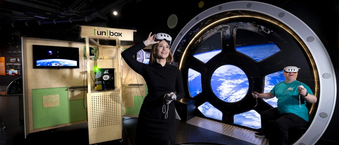 Dr Lynn Verschuren of the University of Glasgow’s Museums in the Metaverse team and Derek Shirlaw of the Glasgow Science Centre try out the un[box] VR kiosk at the Glasgow Science Centre. Credit Martin Shields