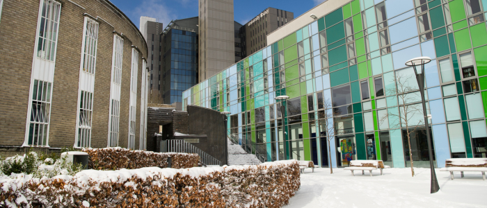 The UofG Library and Fraser Building with snow on the ground and buildings