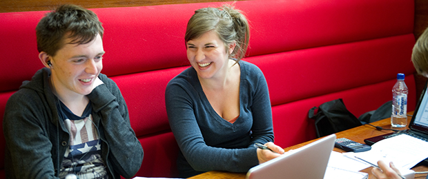 students laughing at a table