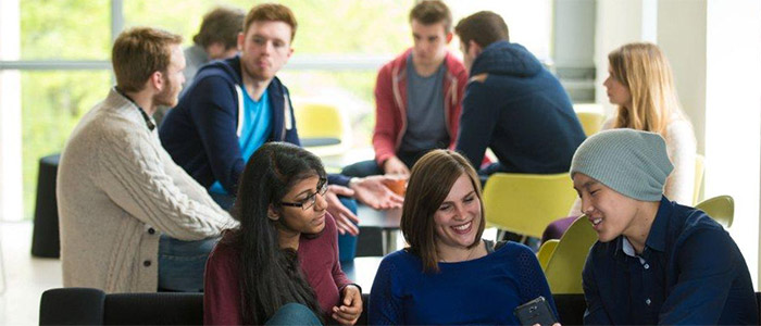 World Changers Welcome text on image of students on campus