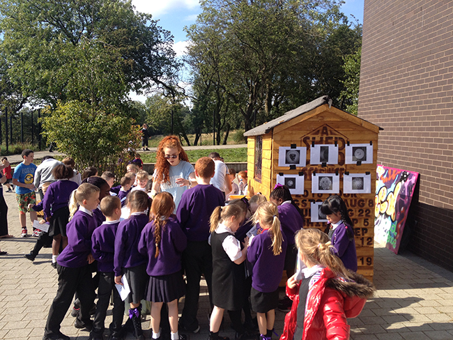 children queue to do the days experiment