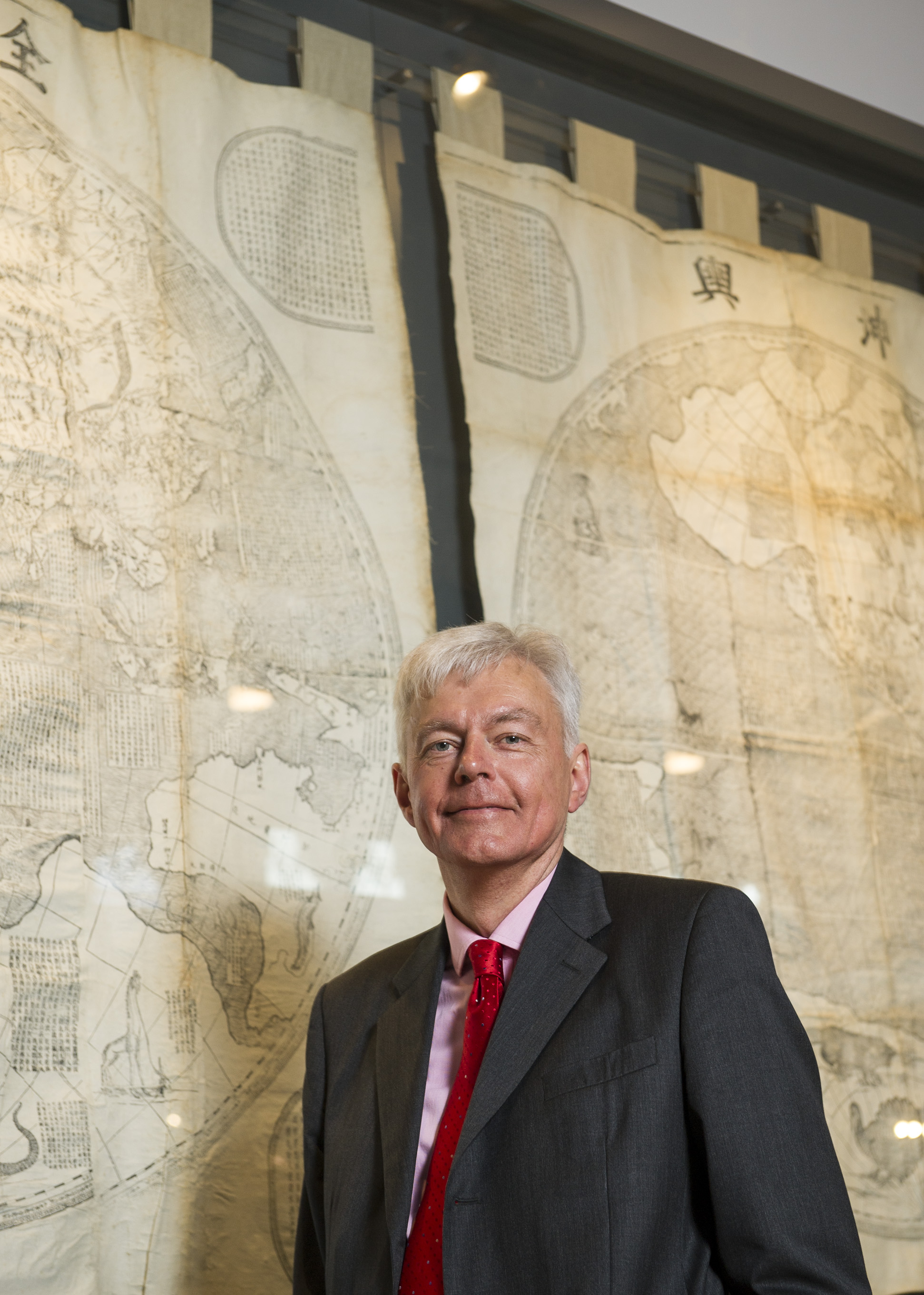 A photograph of a distinguished-looking Professor Pearce