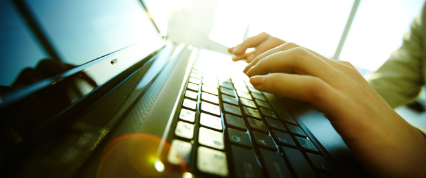 Image of hands using keyboard